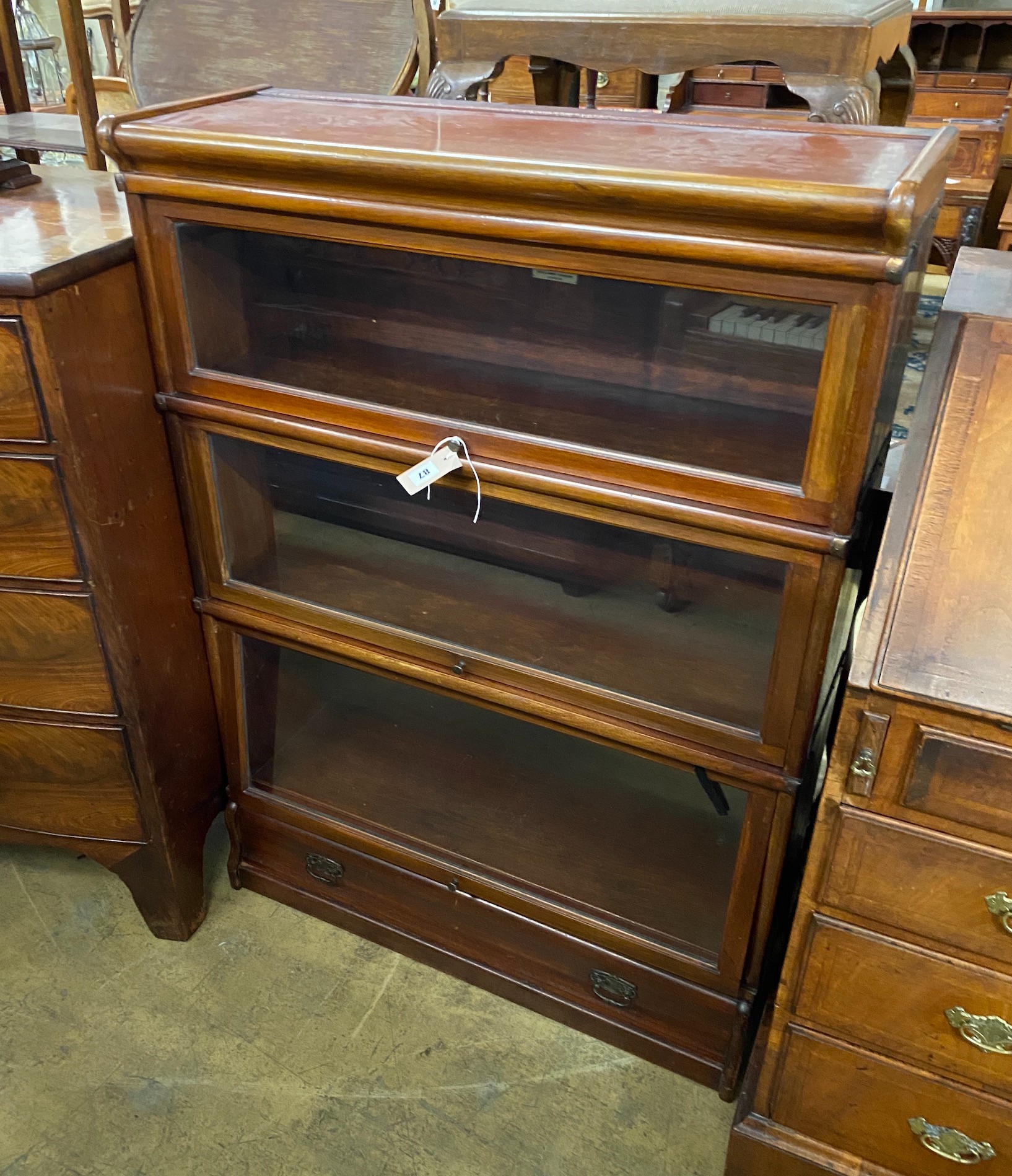 An early 20th century Globe Wernicke mahogany three section bookcase, length 86cm, depth 31cm, height 120cm